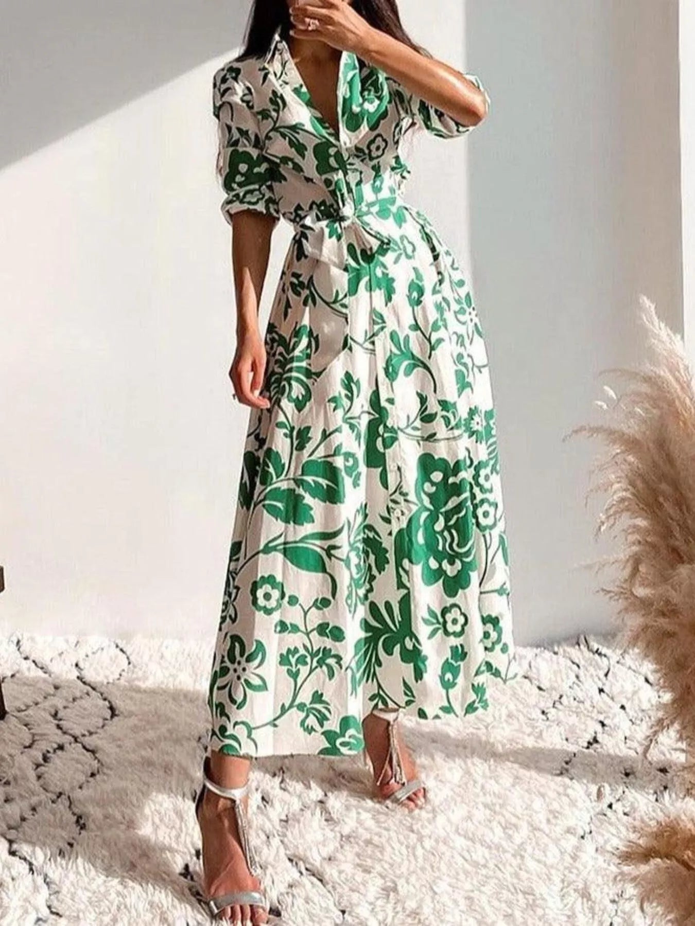 Green floral belted midi dress with V-neck, flared skirt, and 3/4 sleeves