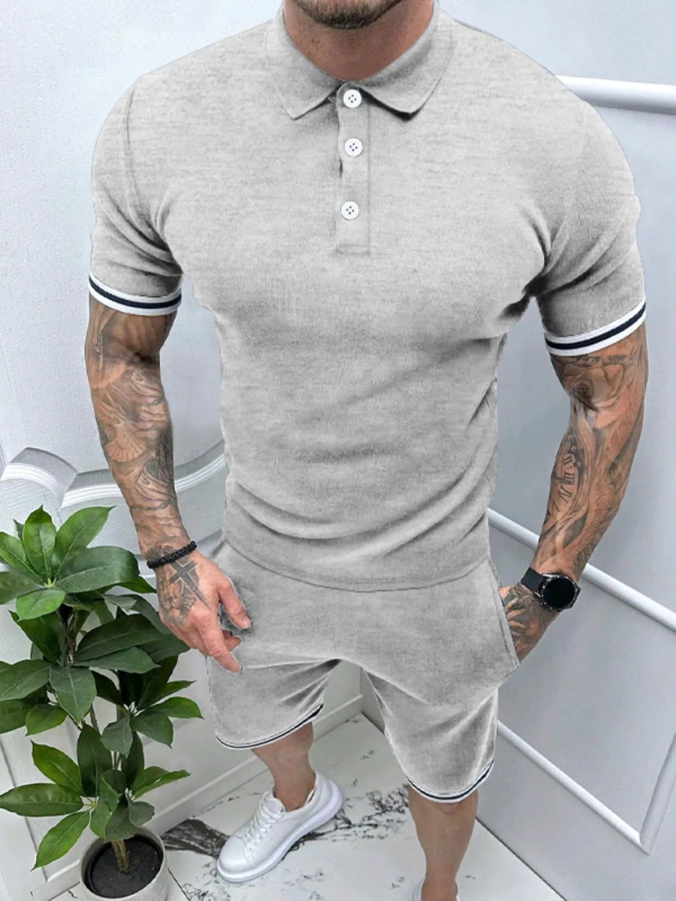 Men's heather gray polo and shorts set with striped sleeve cuffs and button placket.