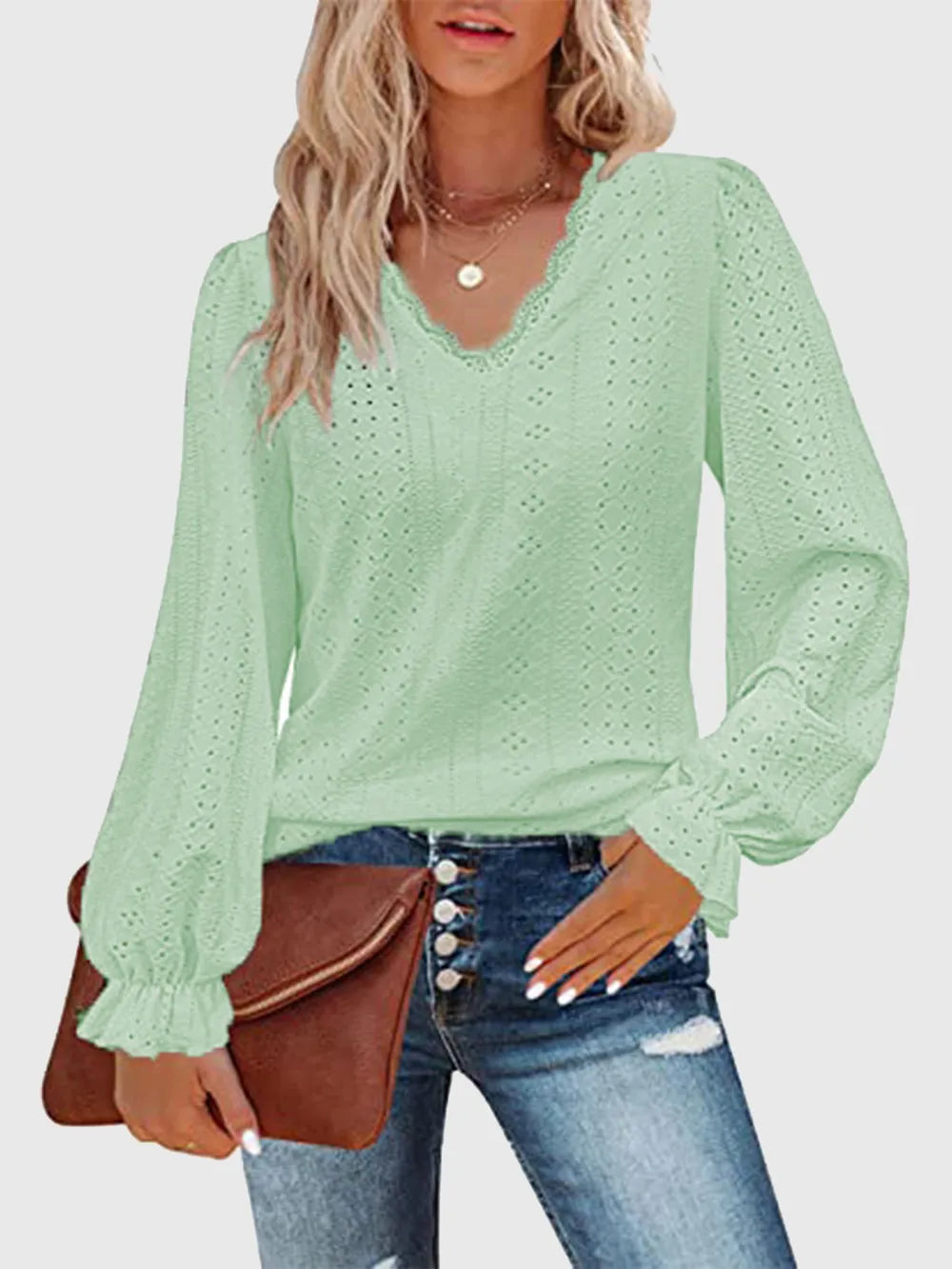 Mint green eyelet V-neck blouse with flounce cuffs and long puff sleeves