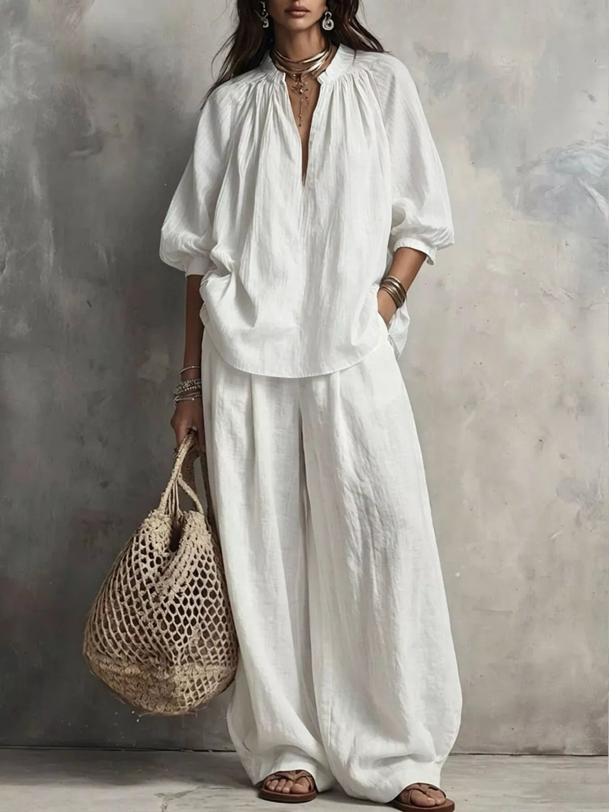 White notched blouse and wide-leg pants set with puff sleeves and relaxed drape