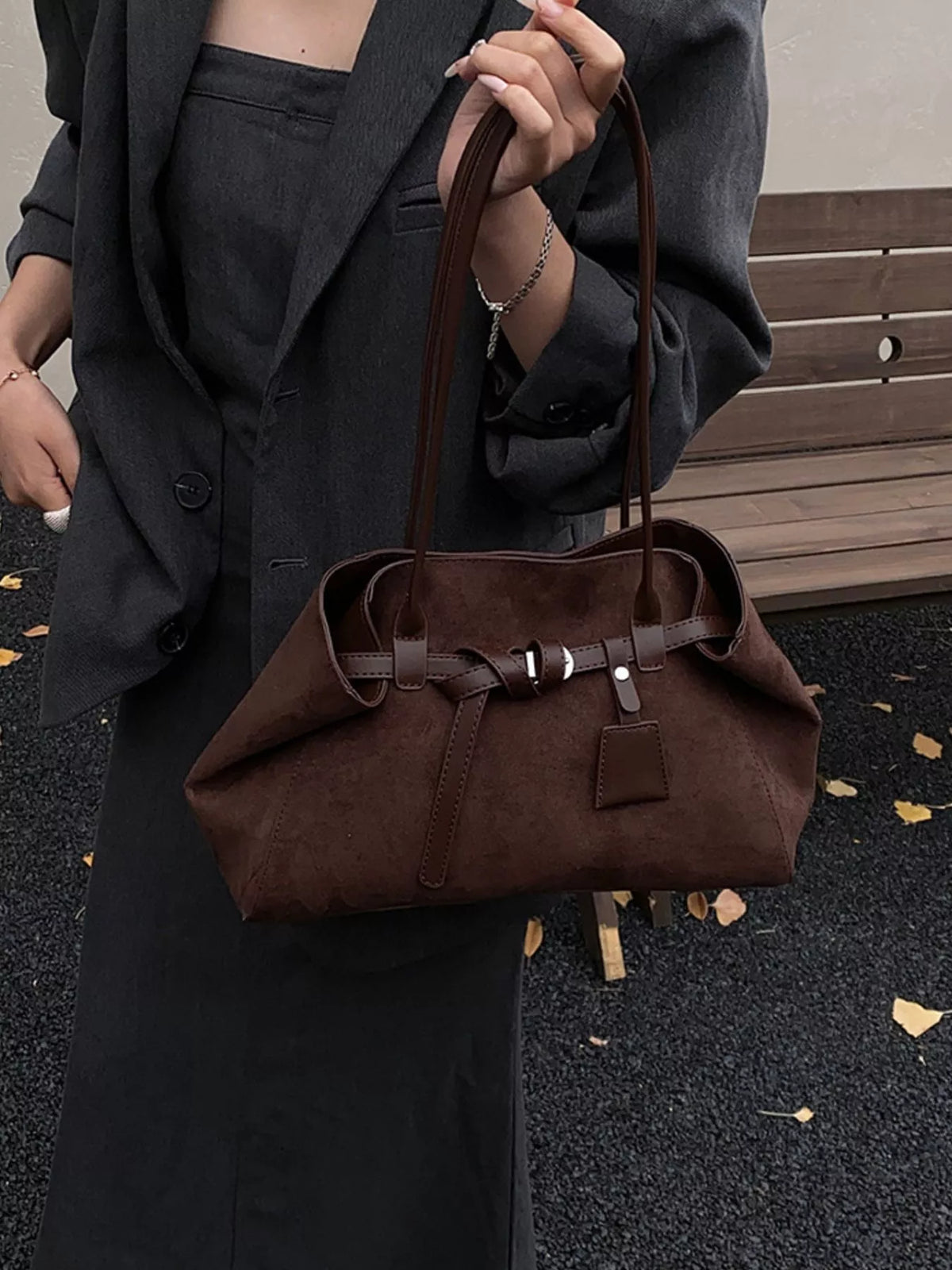 Medium brown suede buckle shoulder bag with front buckle strap and top handles