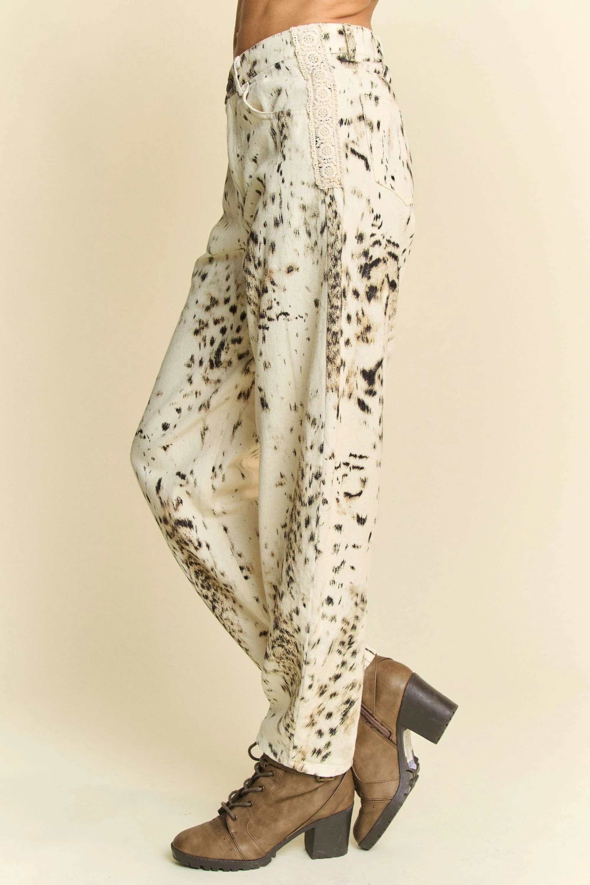 Cream barrel-leg pants with abstract black dot tie-dye print and straight fall