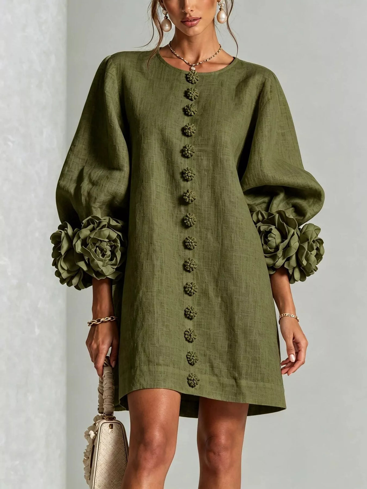 Green linen mini dress with 3D floral applique down front and rose puff sleeves