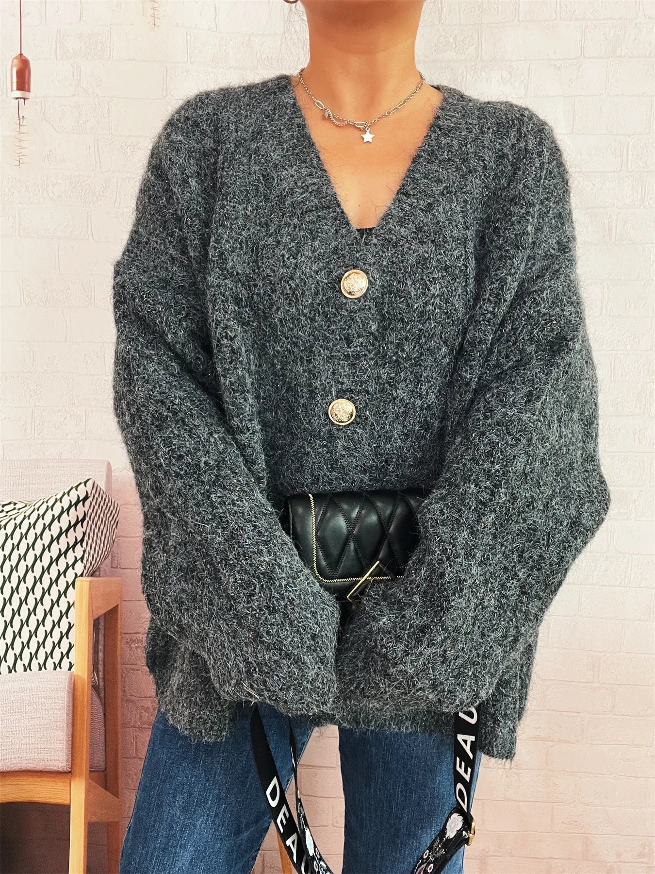 Dark gray V-neck button cardigan with long sleeves and gold front buttons