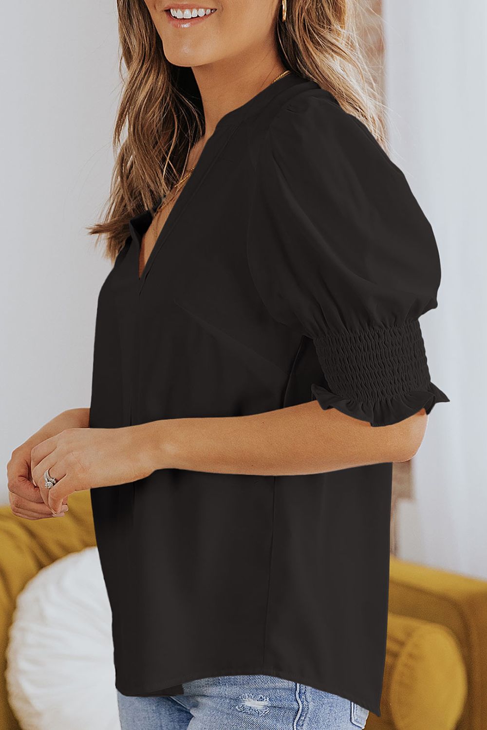 Smocked flounce sleeve blouse with notched V-neck, black gathered puff sleeve design