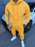 Men's yellow kangaroo pocket hoodie and jogger pants set with drawstring hood