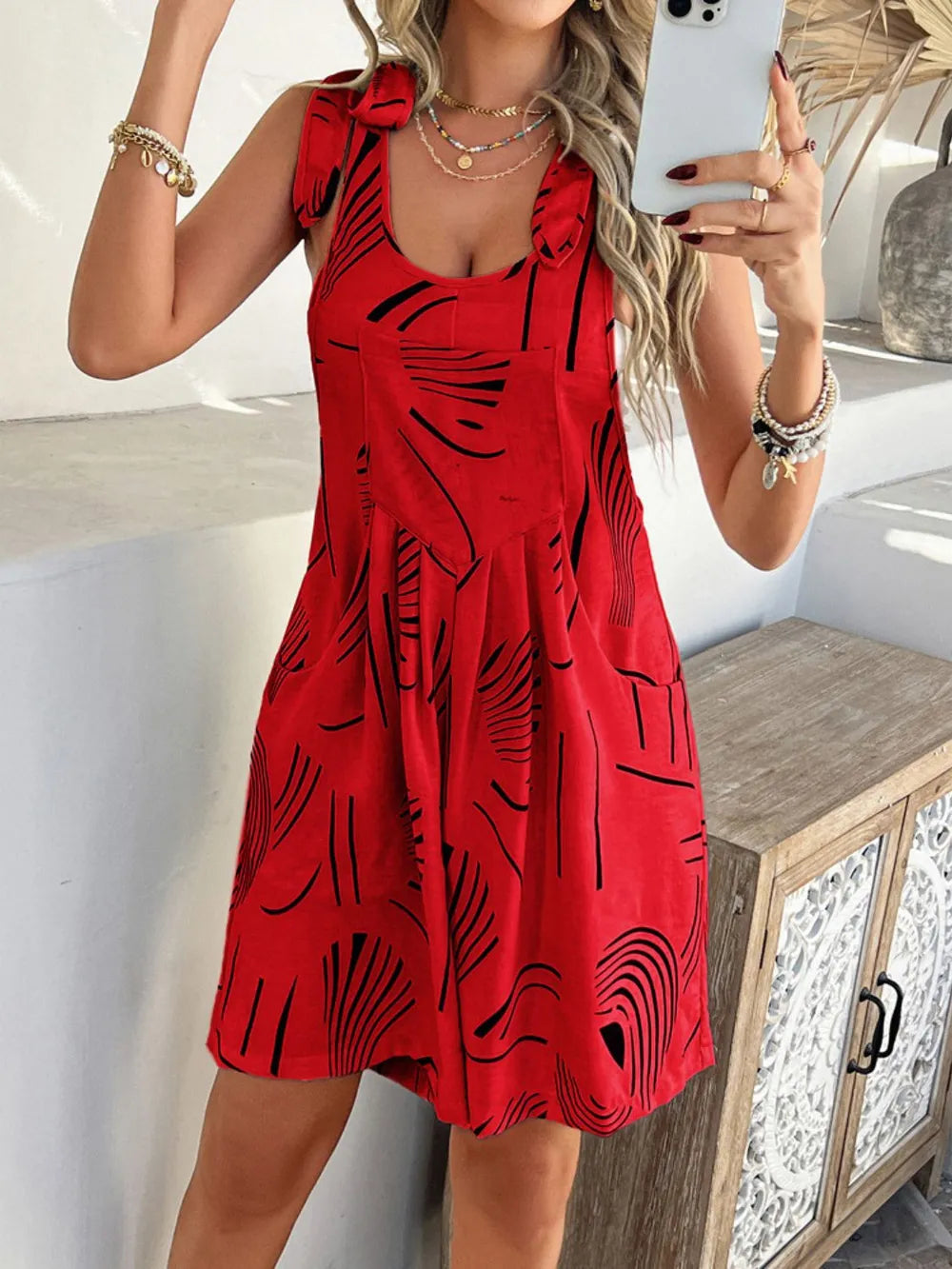 Scarlet red tie-shoulder printed romper with pockets, swirl pattern