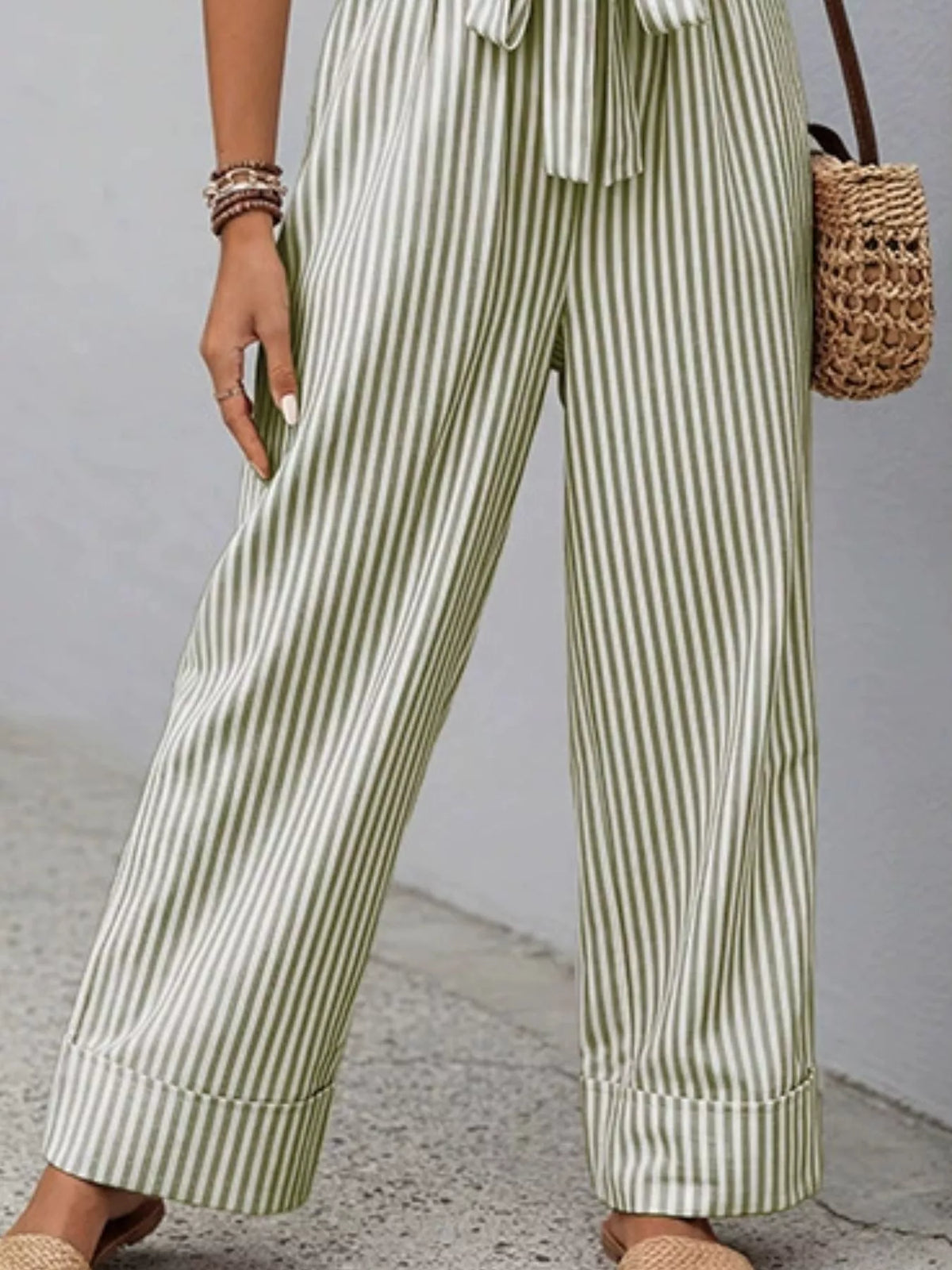 Striped belted wide-leg jumpsuit in army green and white, sleeveless, button front