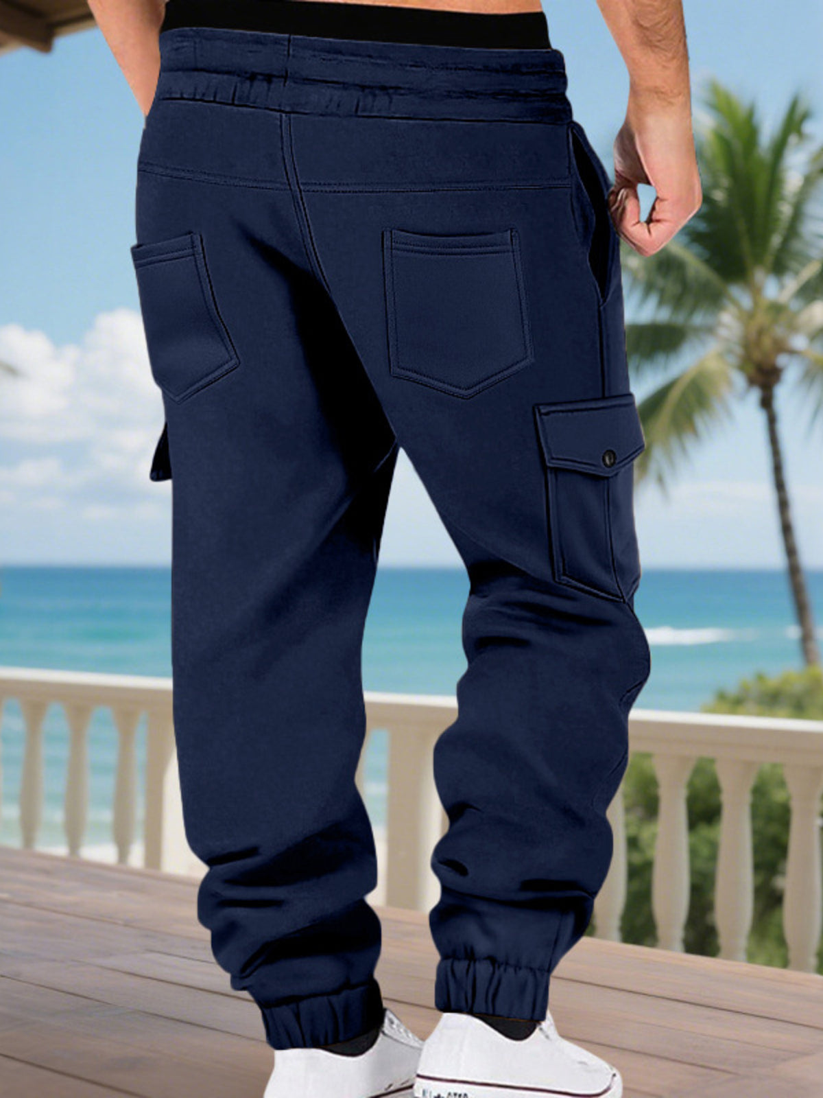 Men's navy cargo jogger pants with drawstring waist and side flap pockets