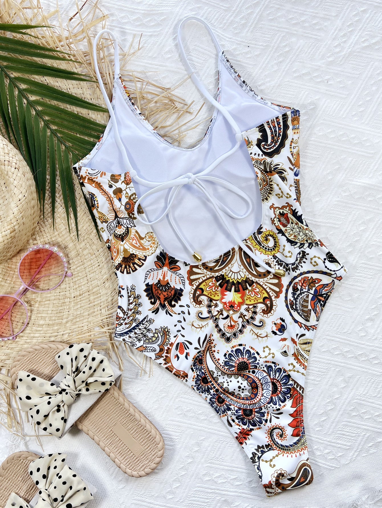 White paisley printed one-piece swimsuit, scoop back with adjustable tie strap detail
