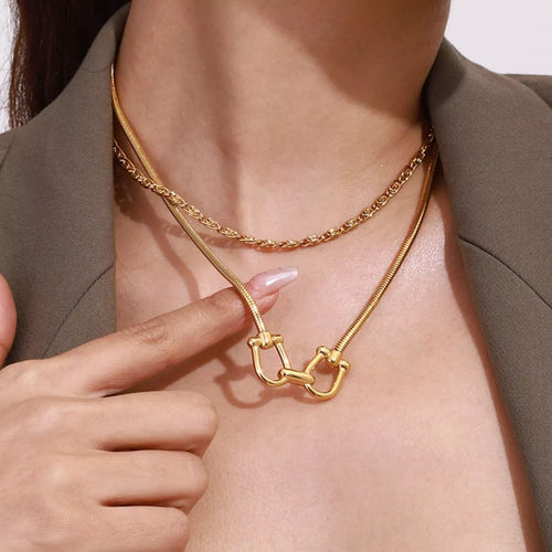 Gold-plated horseshoe necklace with linked U-shaped centerpiece and rope chain layers