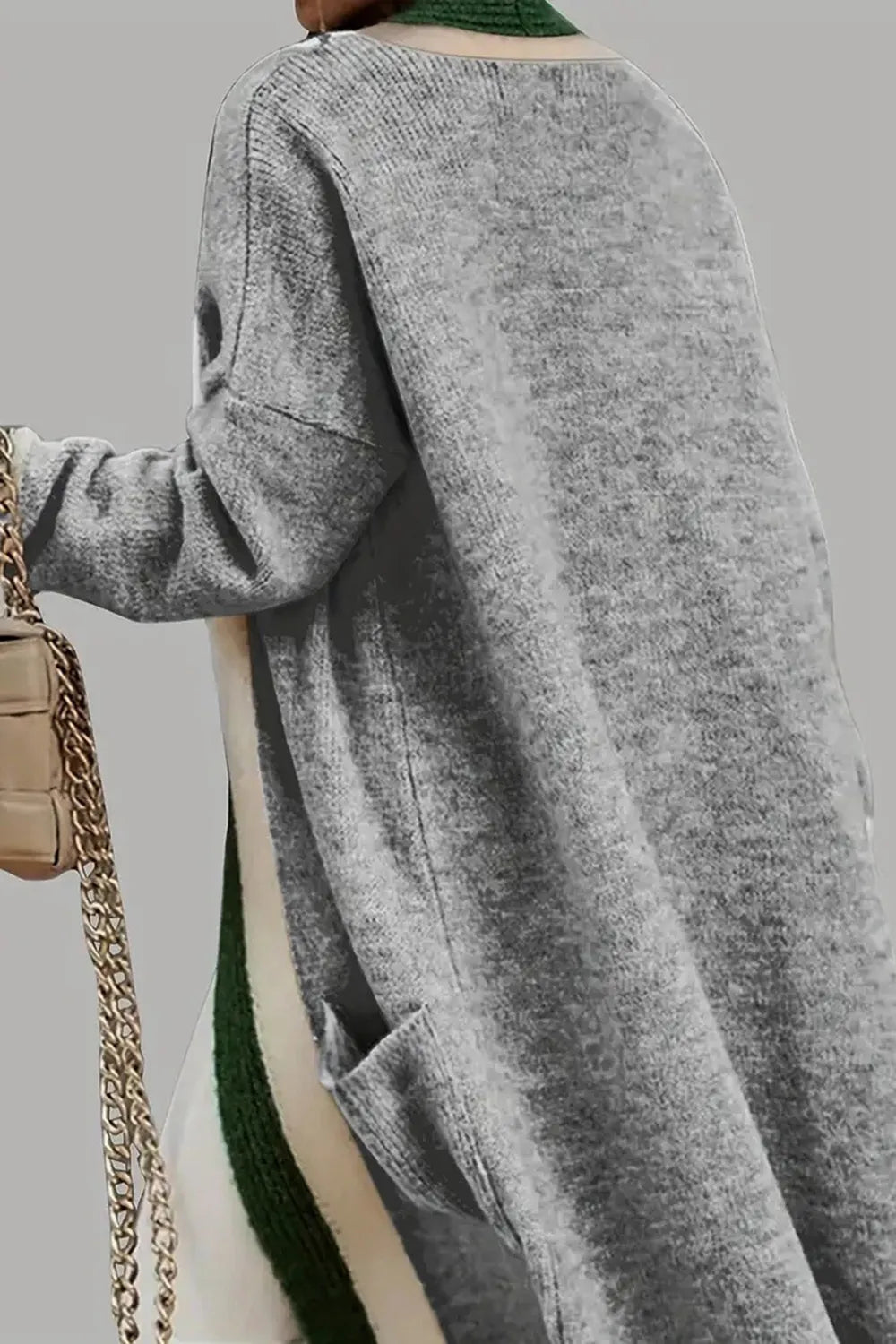 Back view hooded long cardigan in gray with green contrast trim and long sleeves