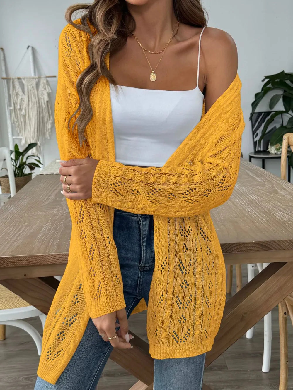 Gold openwork long-sleeve cardigan with open front, textured diamond knit pattern.