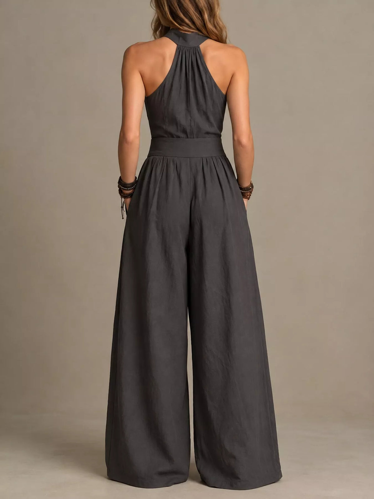 Charcoal halter linen jumpsuit back view with keyhole neck and wide legs