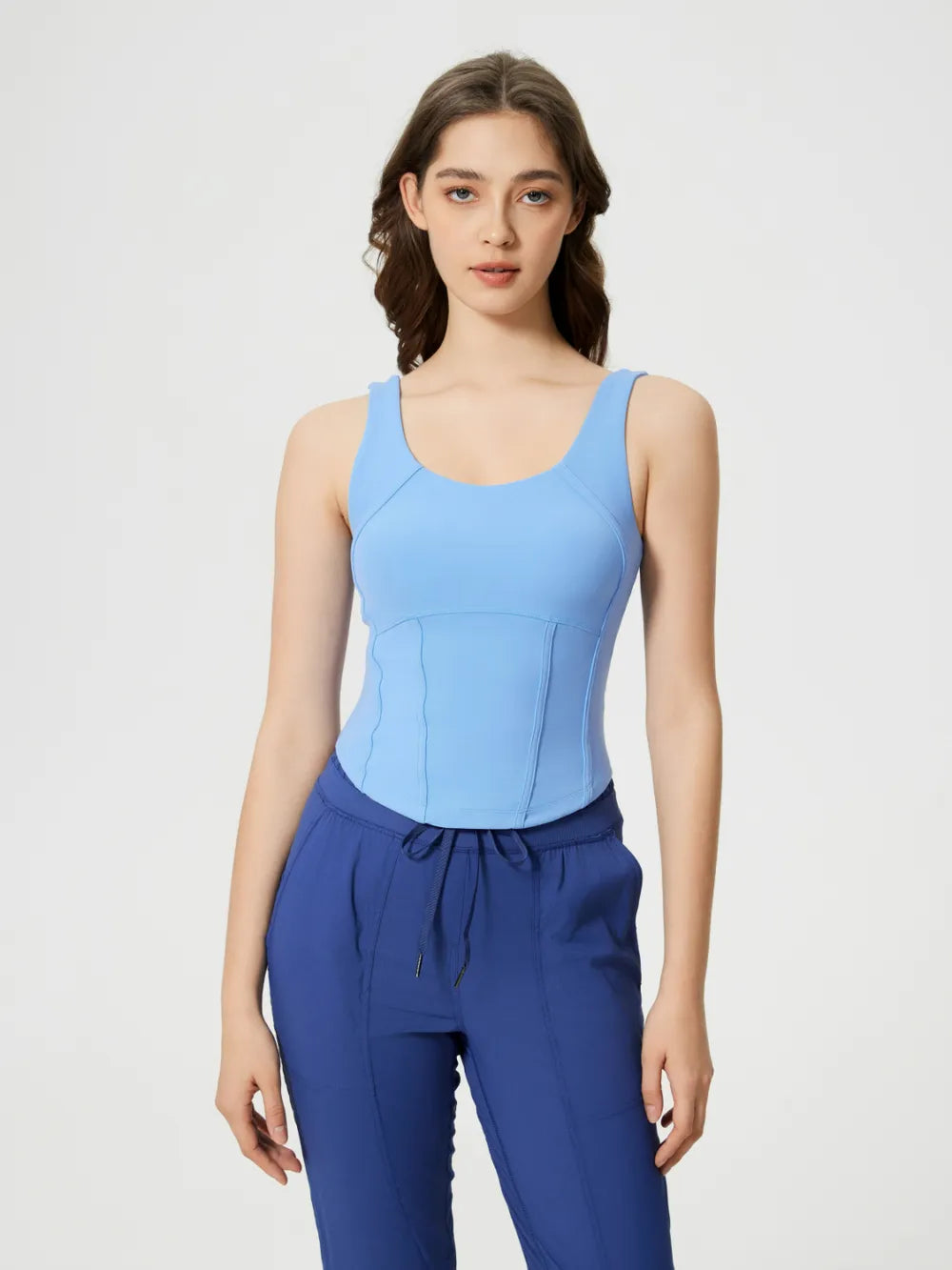 Light blue round-neck active tank with wide straps and fitted seam shaping