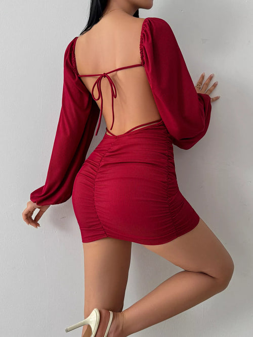 Burgundy backless square-neck mini dress with tied back straps and ruched skirt