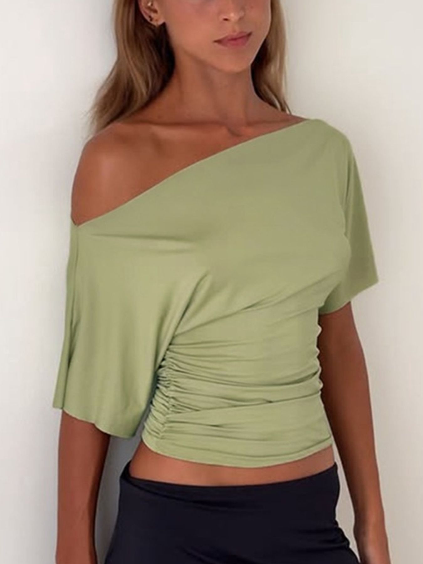 Cedar & Moore: One-Shoulder Ruched Short-Sleeve T-Shirt in sage green by Trendsi.