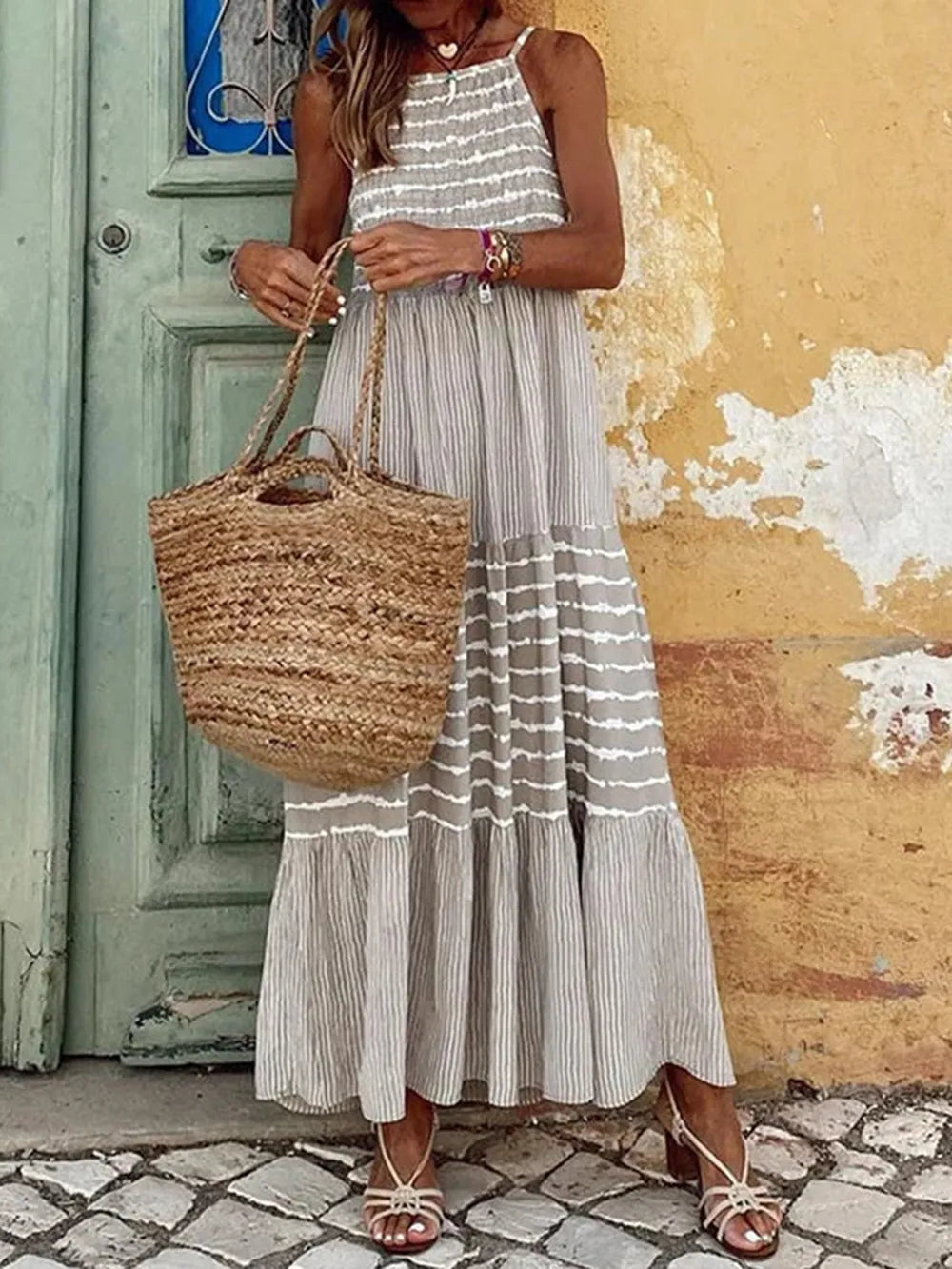 Light gray tiered striped sleeveless cami dress with gathered waist and layered skirt