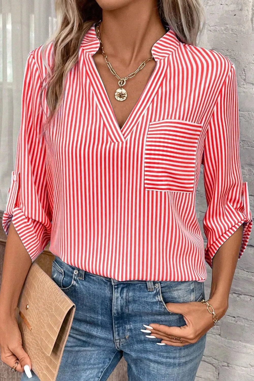 Red and white striped notched V-neck shirt with chest pocket and roll-tab sleeves