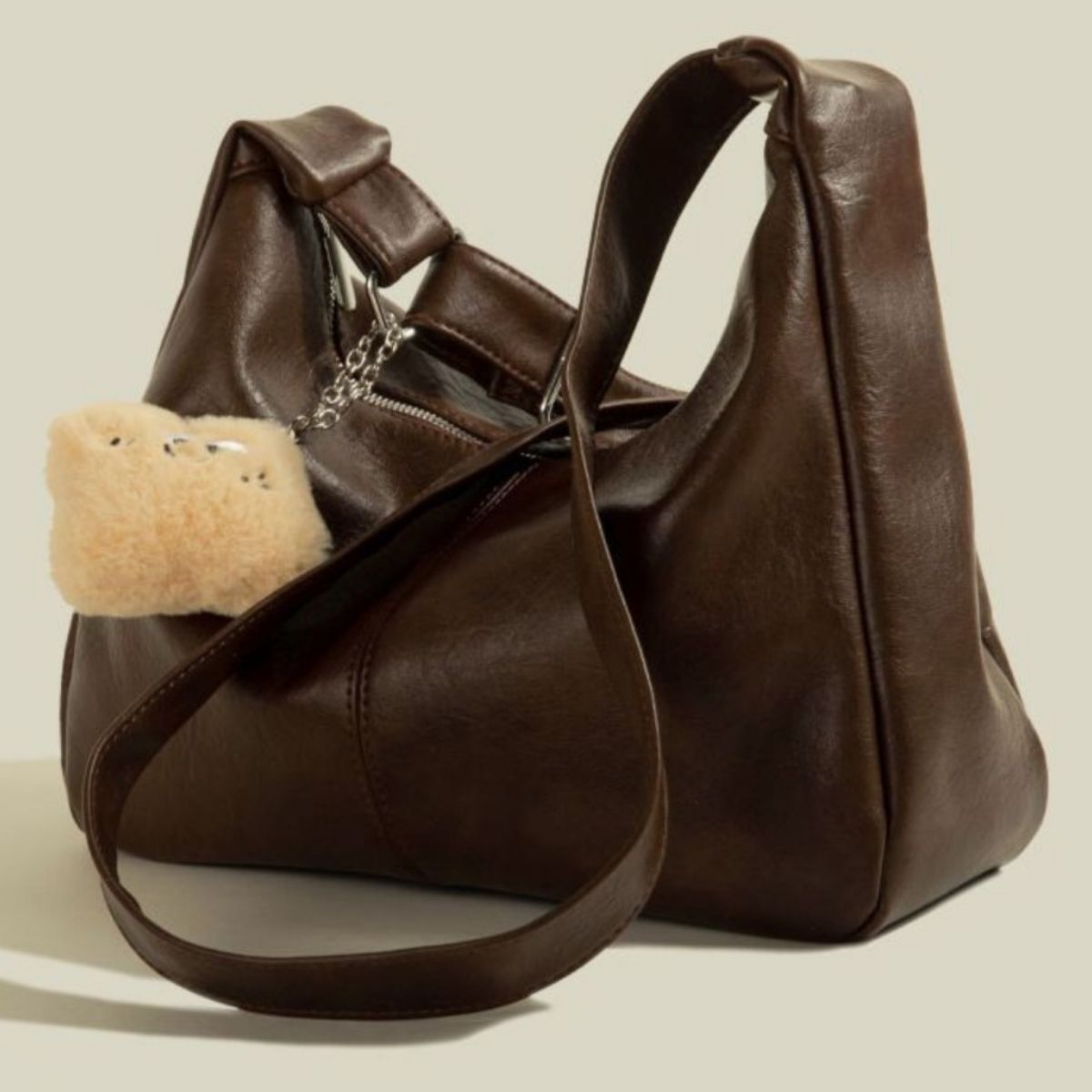 Adjustable Strap Shoulder Bag by Trendsi, brown PU leather, medium, with fur pom-pom charm