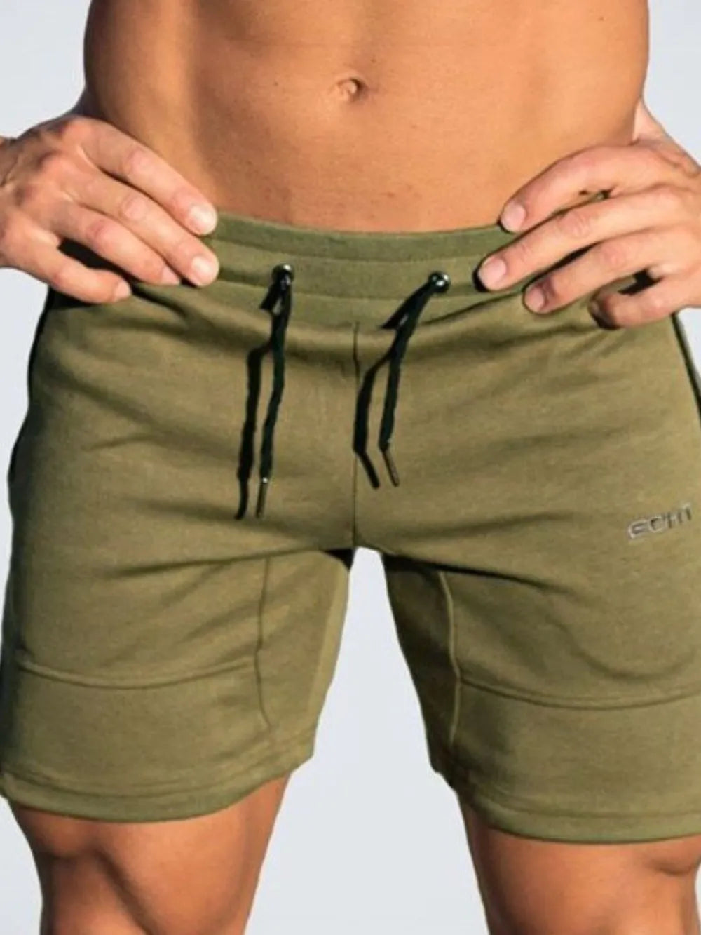 Moss green drawstring shorts with front tie cords and stitched side pockets