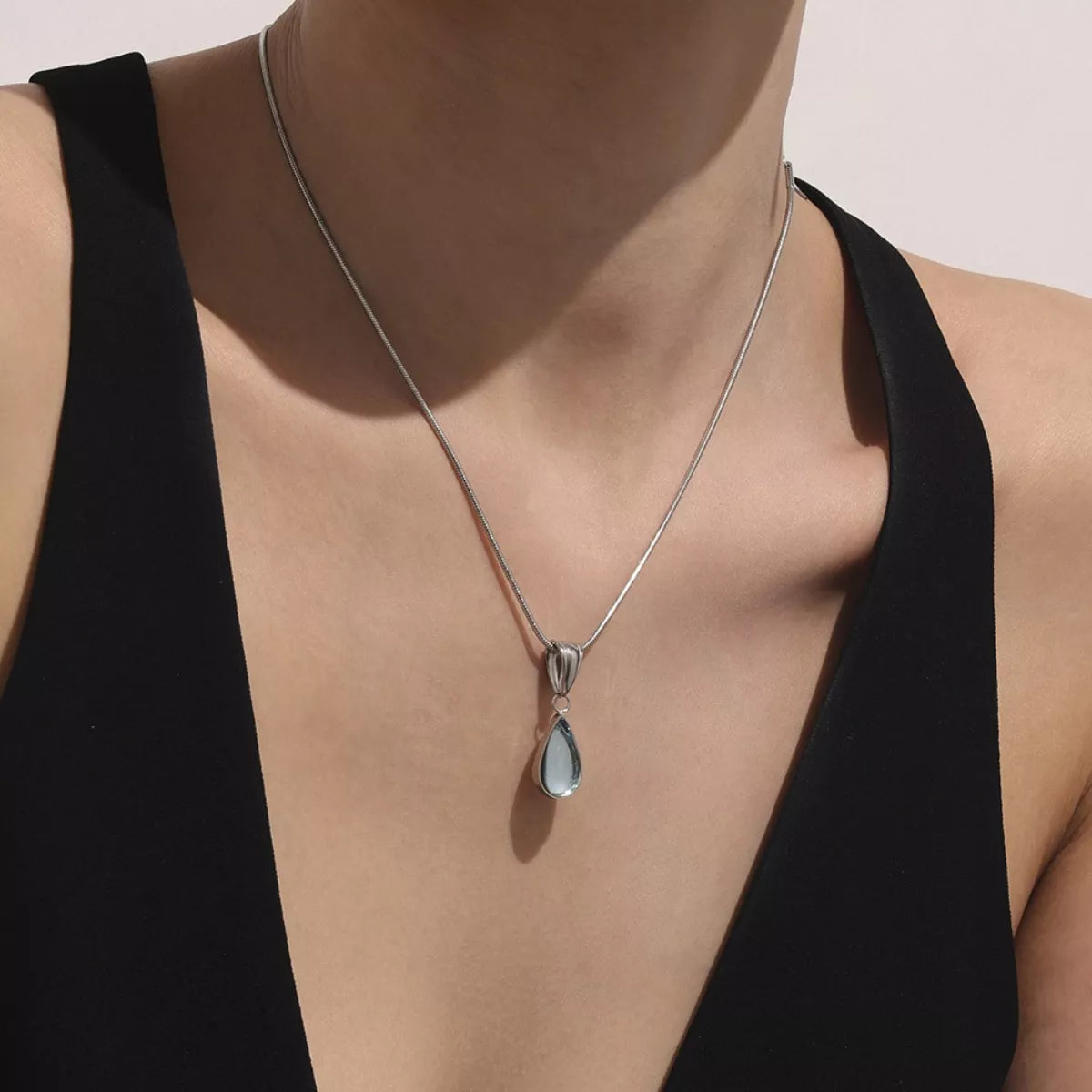 Silver-tone teardrop necklace with blue glass teardrop pendant