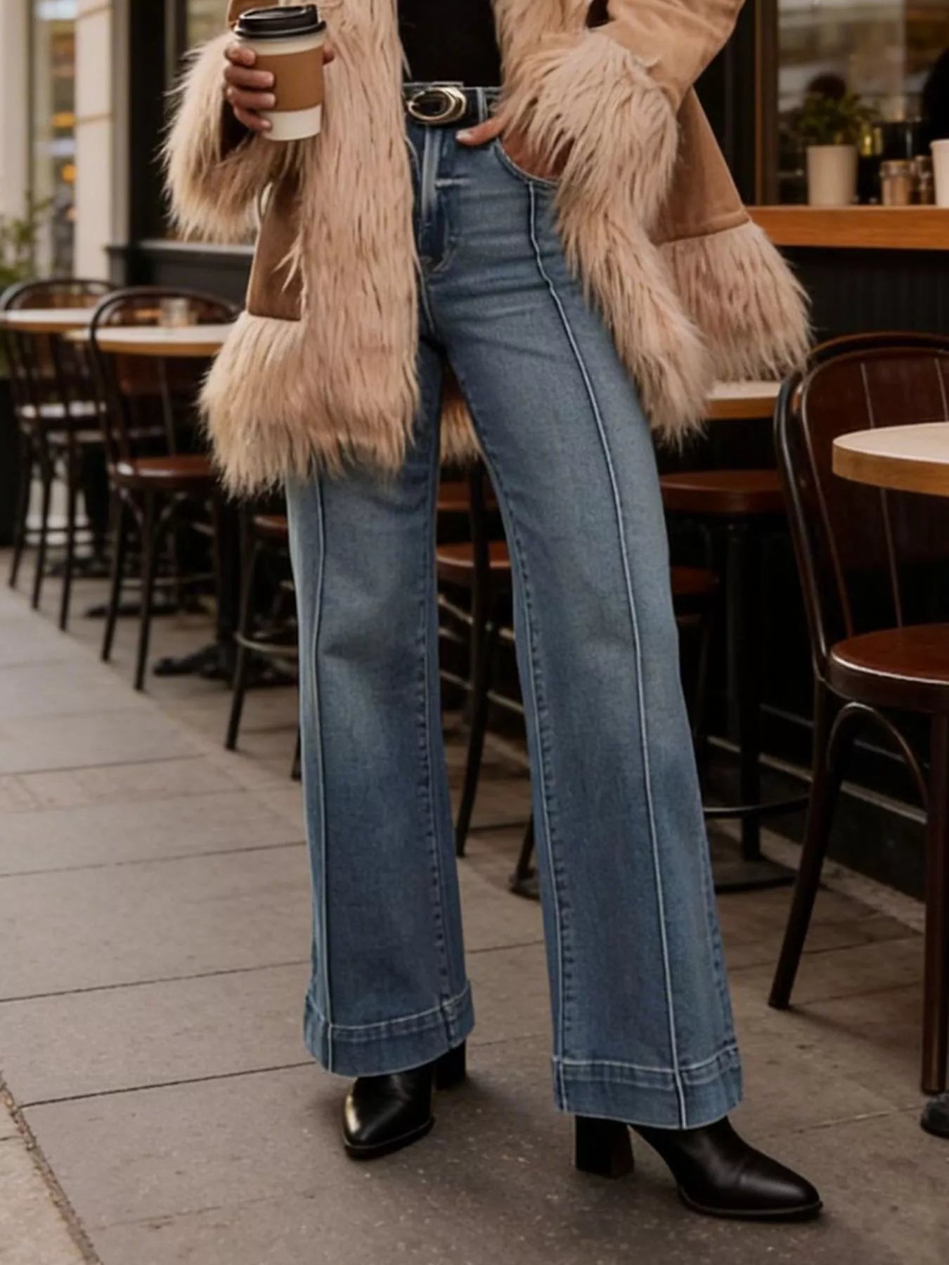 Blue high-waisted flare-leg jeans with wide flared legs and front pockets