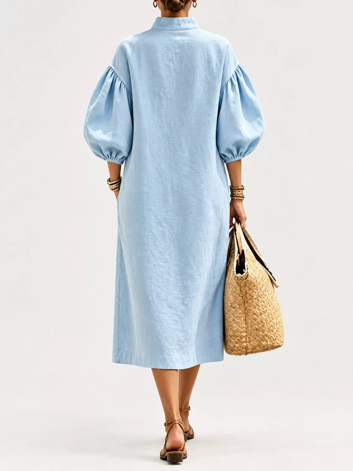 Light blue back view midi dress with half-zip and gathered puff sleeves