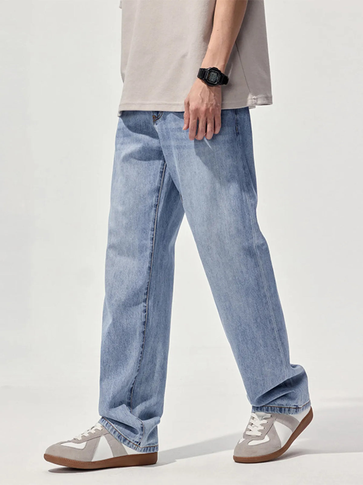 Light blue washed relaxed straight jeans with wide leg opening and five-pocket styling