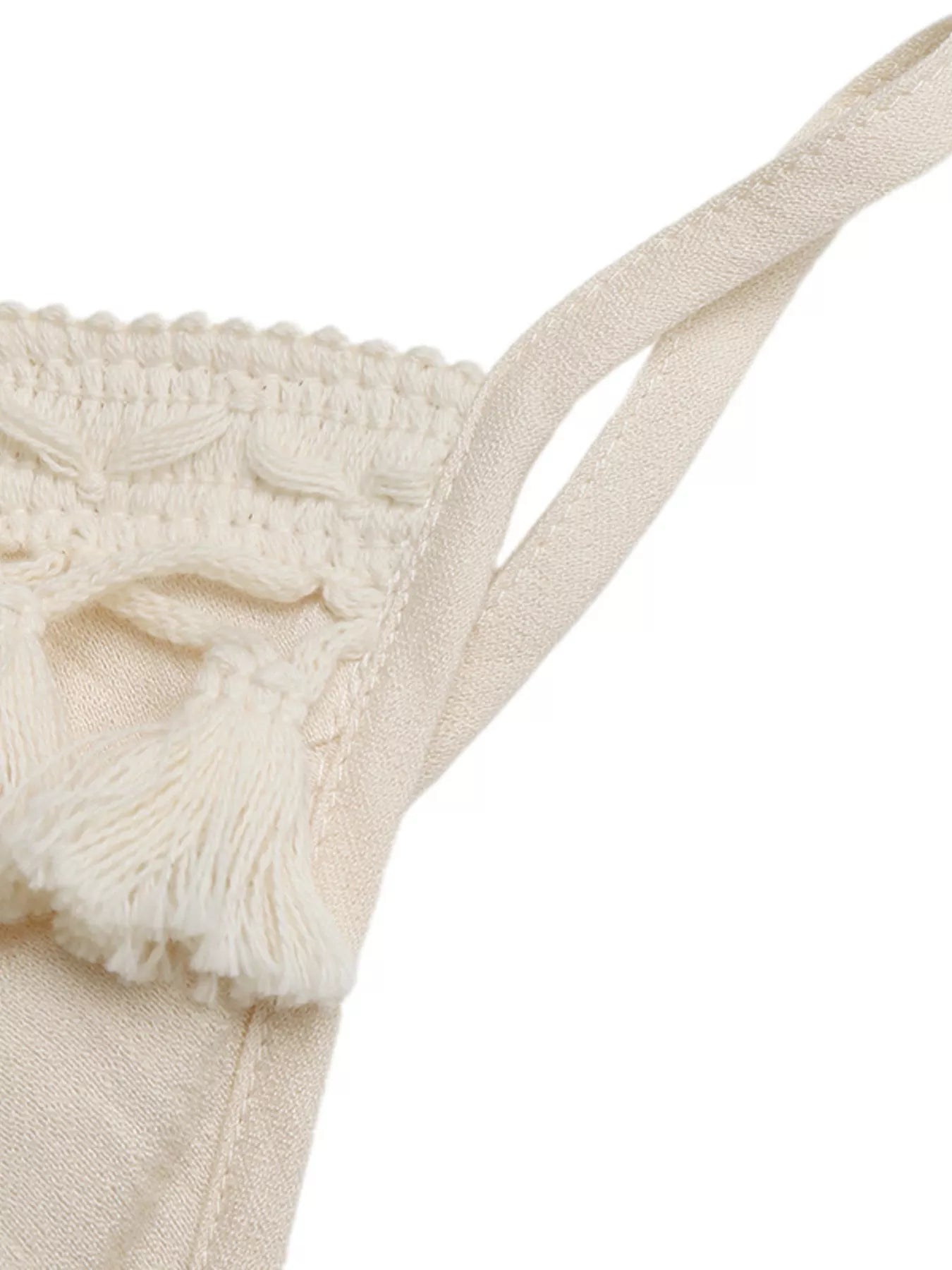 Cedar & Moore Lace Trim Spaghetti Strap Jumpsuit in beige fabric with tassel fringe