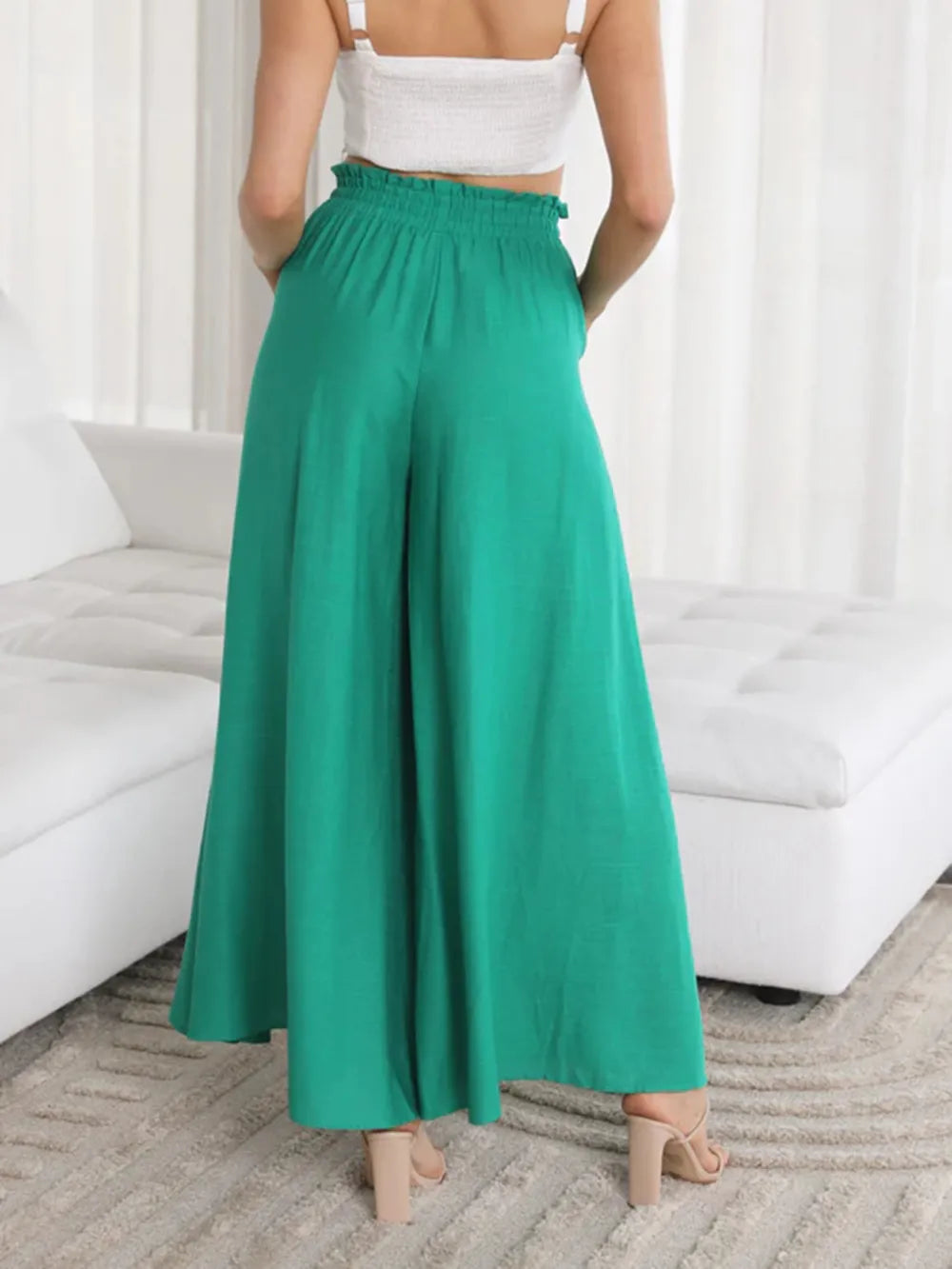 Matcha green wide-leg pants with gathered elastic waist and wide, relaxed legs