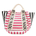 Hot pink and white striped tote bag with By NICOLE LEE lettering on straps