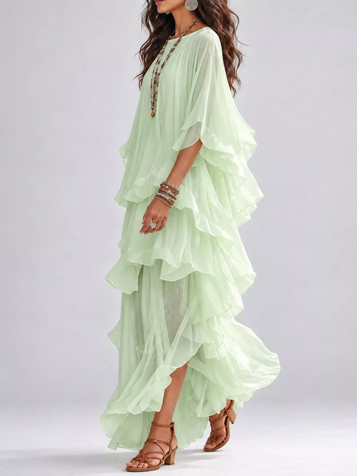 Light green layered maxi dress with cascading ruffled tiers and flutter sleeves