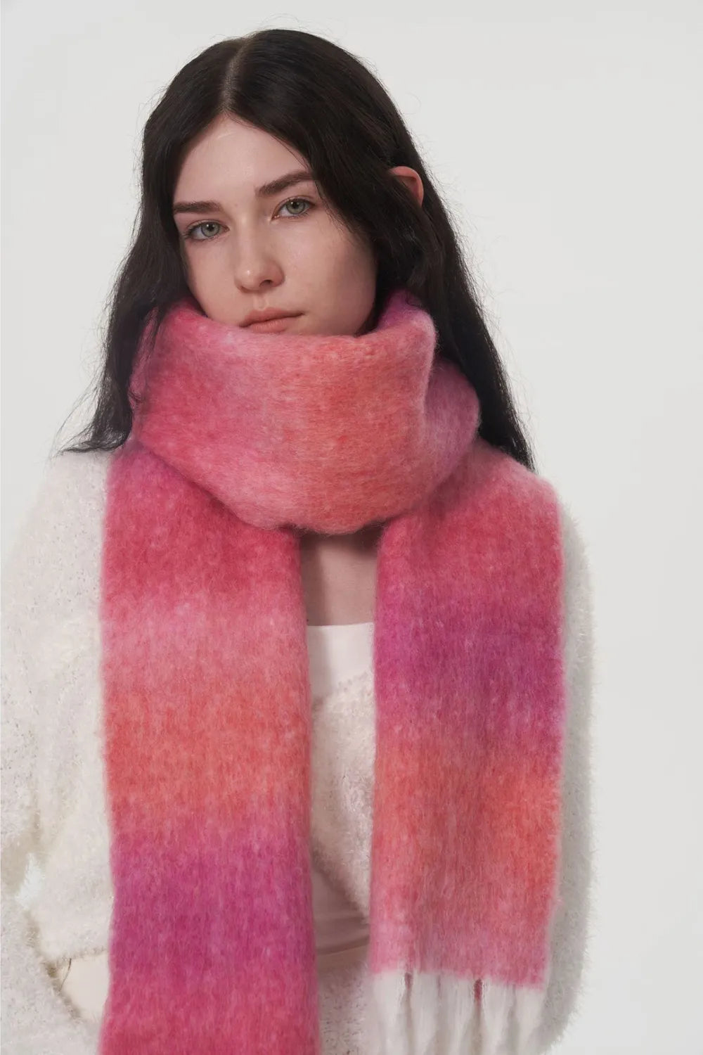 Pink gradient thermal scarf with fuzzy feel and frayed fringe trim.