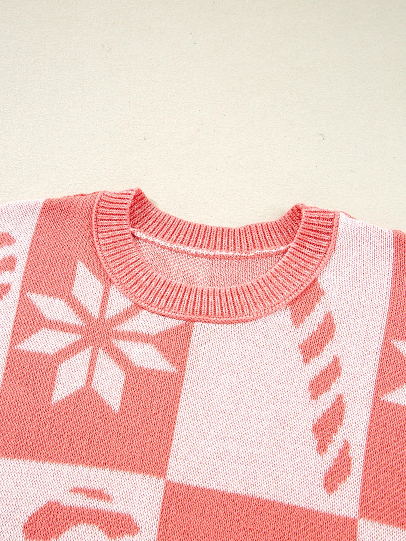 Burnt coral and white sweater neckline with ribbed crew collar and snowflake checker pattern
