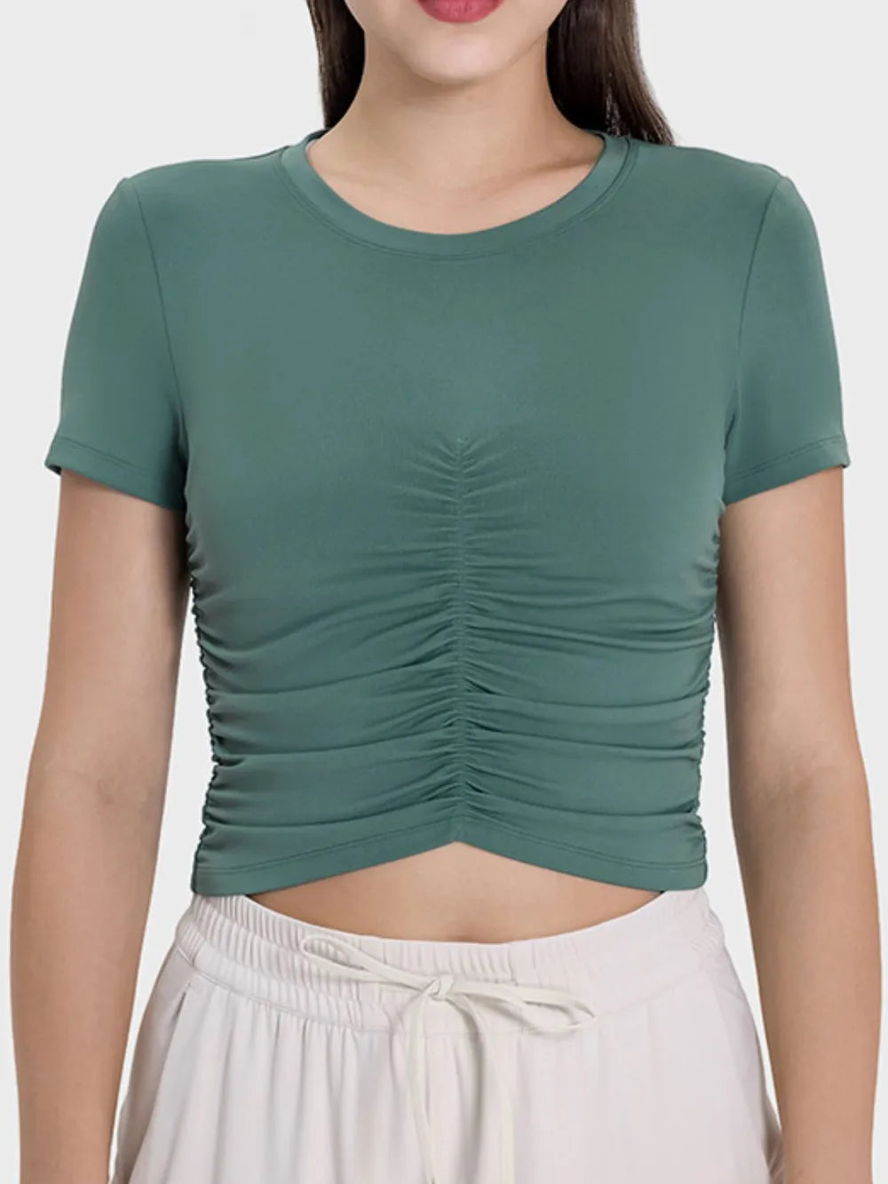 Ruched active t-shirt in dark green with round neckline and short sleeves