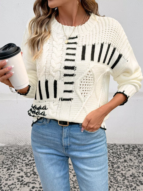 Ivory cable knit round-neck sweater with black graphic stripes at the front