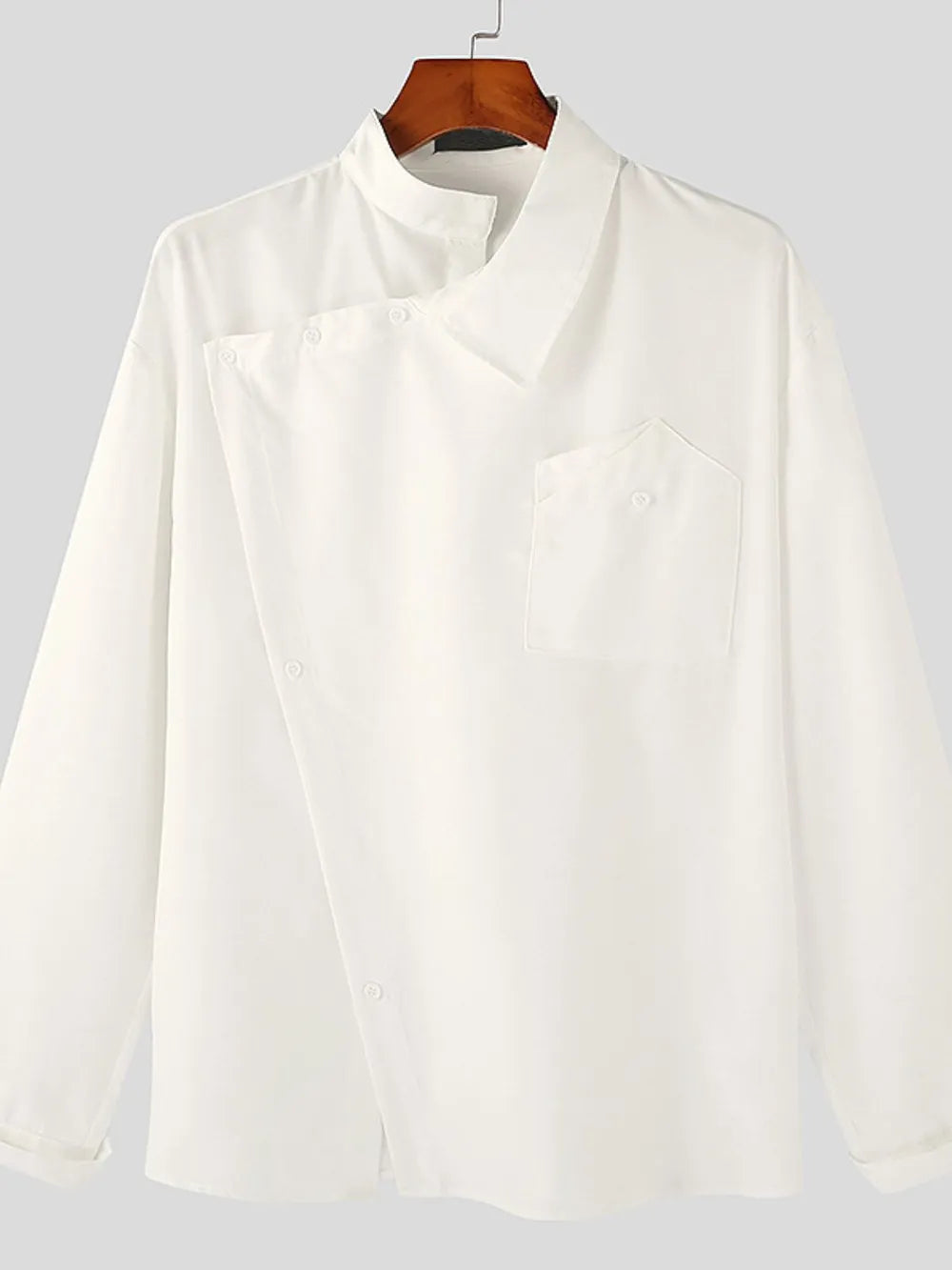 White asymmetrical long sleeve shirt on hanger with mandarin collar and chest pocket