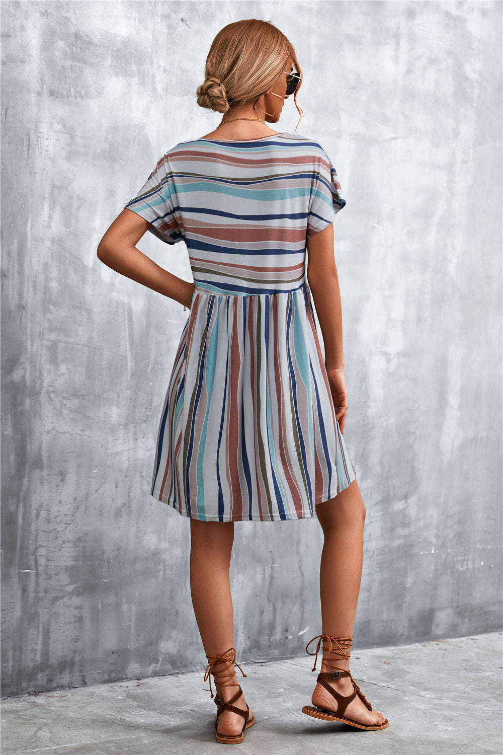 Striped round-neck dress, back view, short sleeves, blue vertical stripes with coral accents