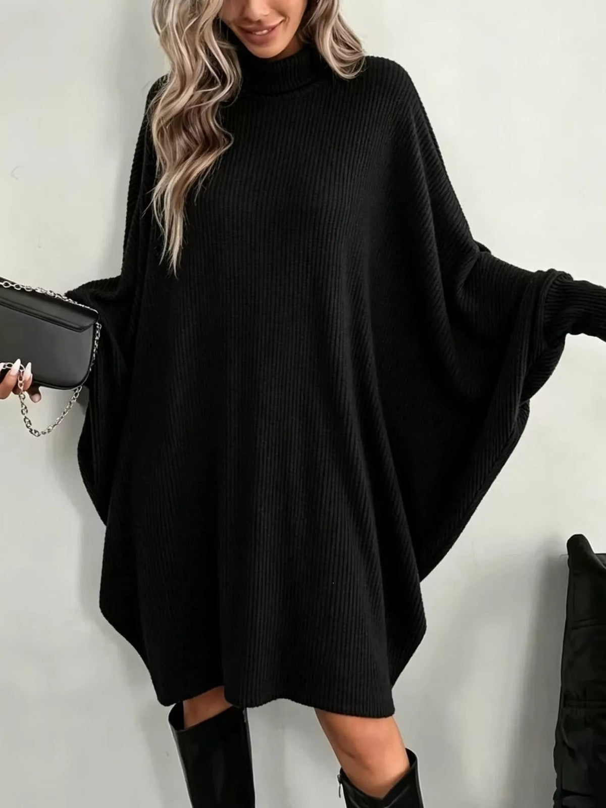 Black oversized ribbed knit turtleneck sweater dress with wide long sleeves