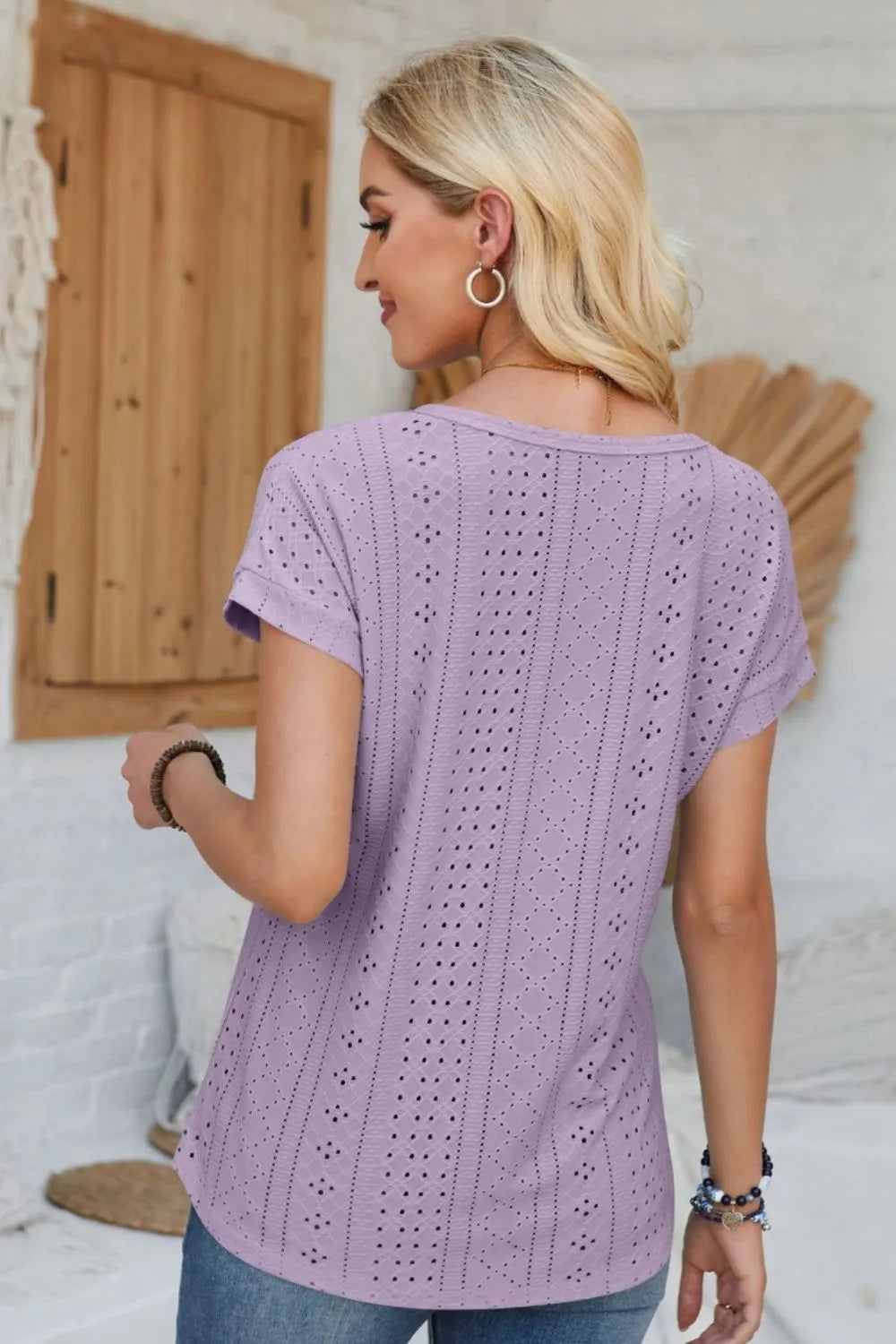 Lavender eyelet round-neck short-sleeve t-shirt, back view with vertical stitching