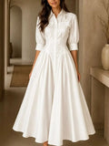 White button-down shirt dress with cinched waist and full, flared skirt