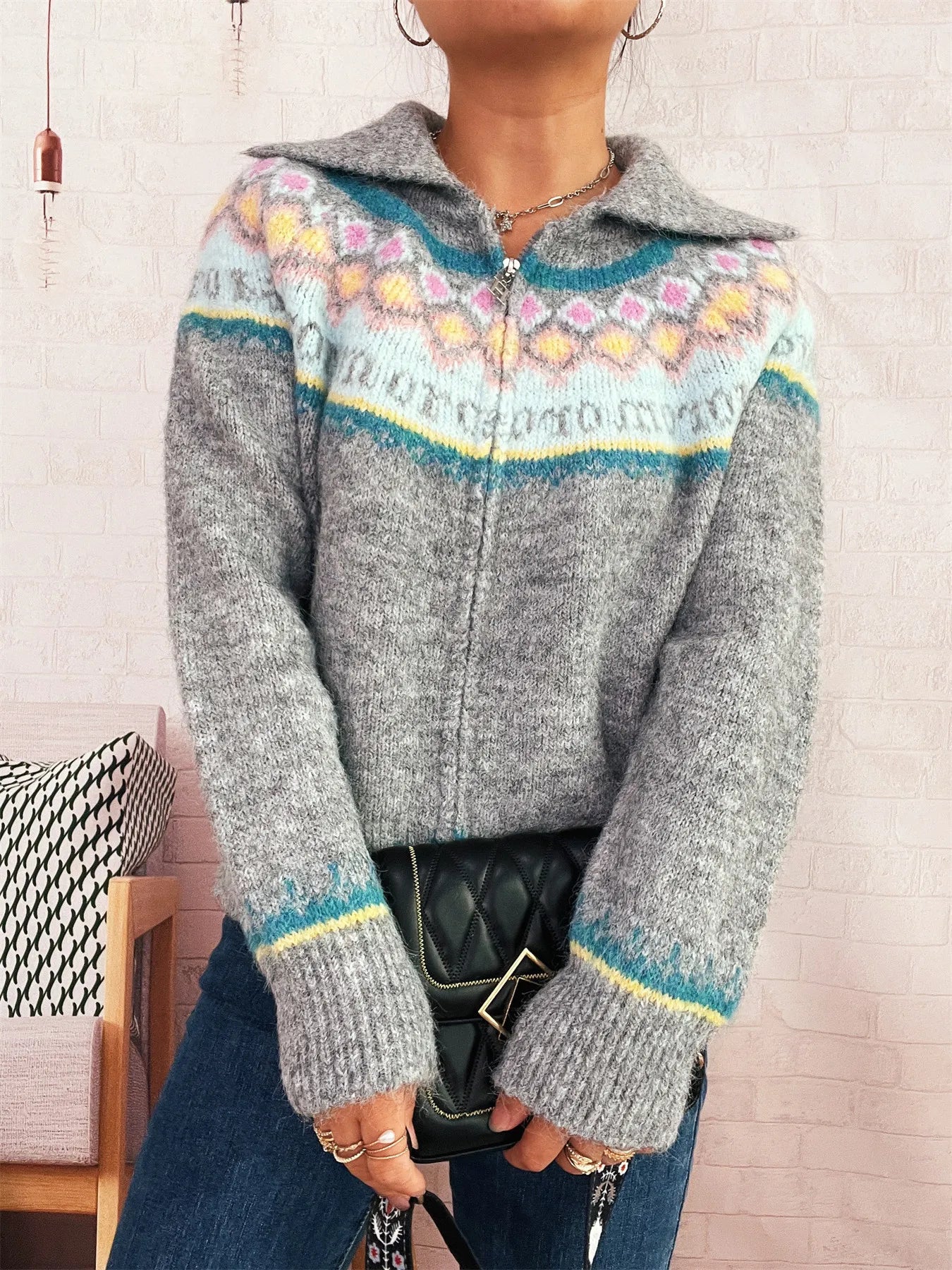 Gray Fair Isle zip-up cardigan with centered zipper and hooded collar, long sleeves