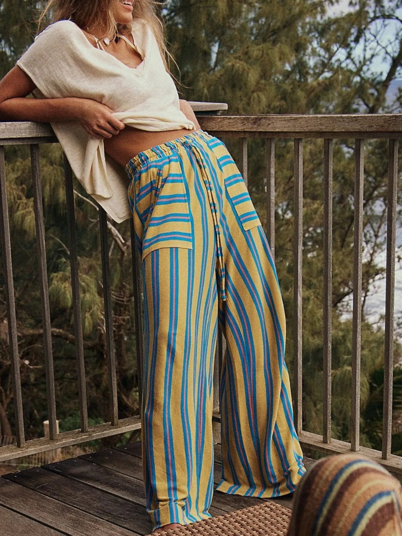Blue-and-yellow striped wide-leg drawstring pants with full-length wide legs