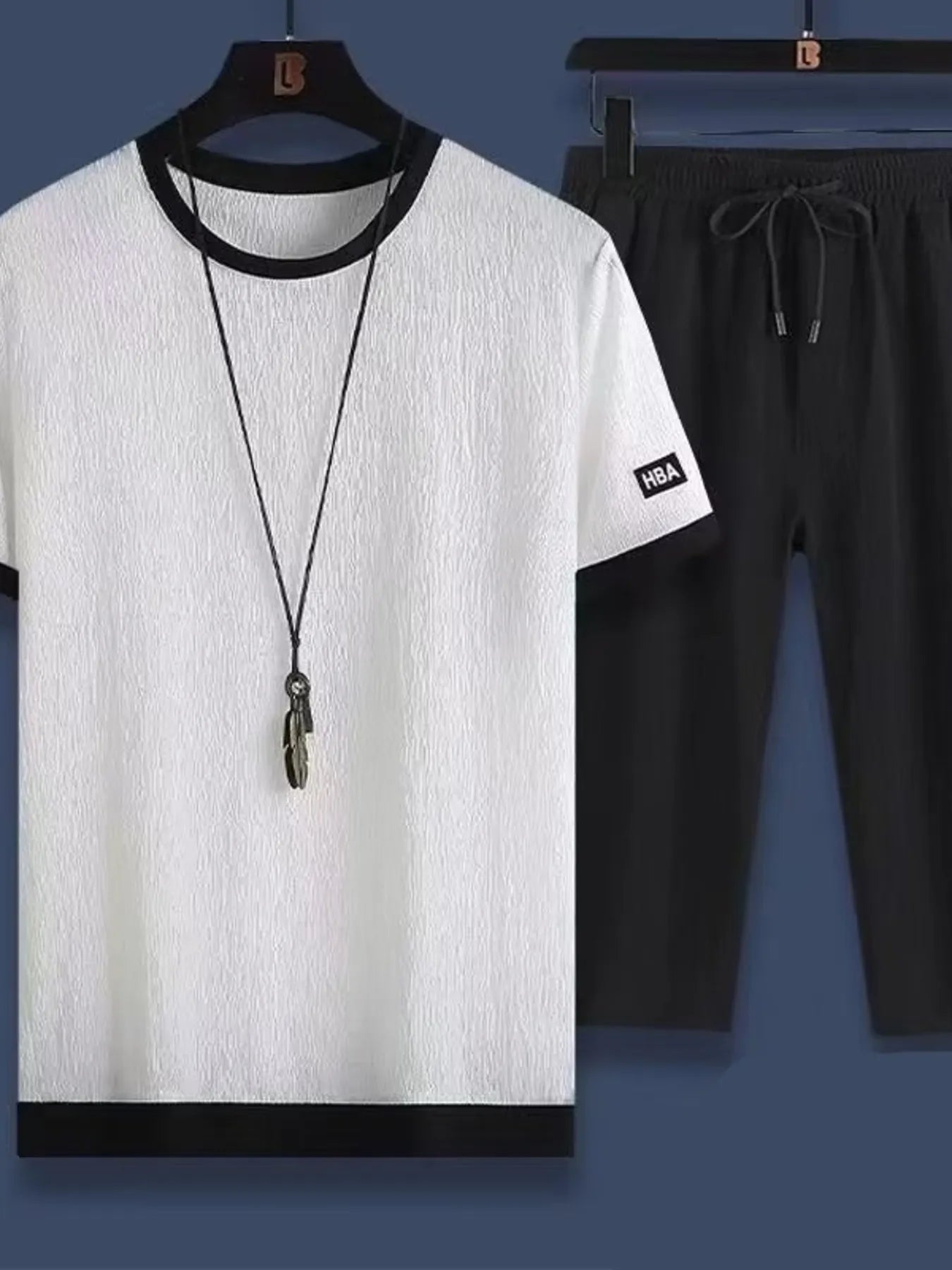White round-neck short-sleeve top and black drawstring shorts set for men