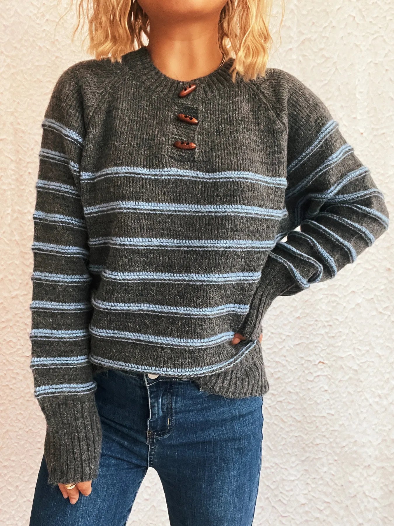 Dark gray striped long sleeve sweater with button placket and ribbed cuffs