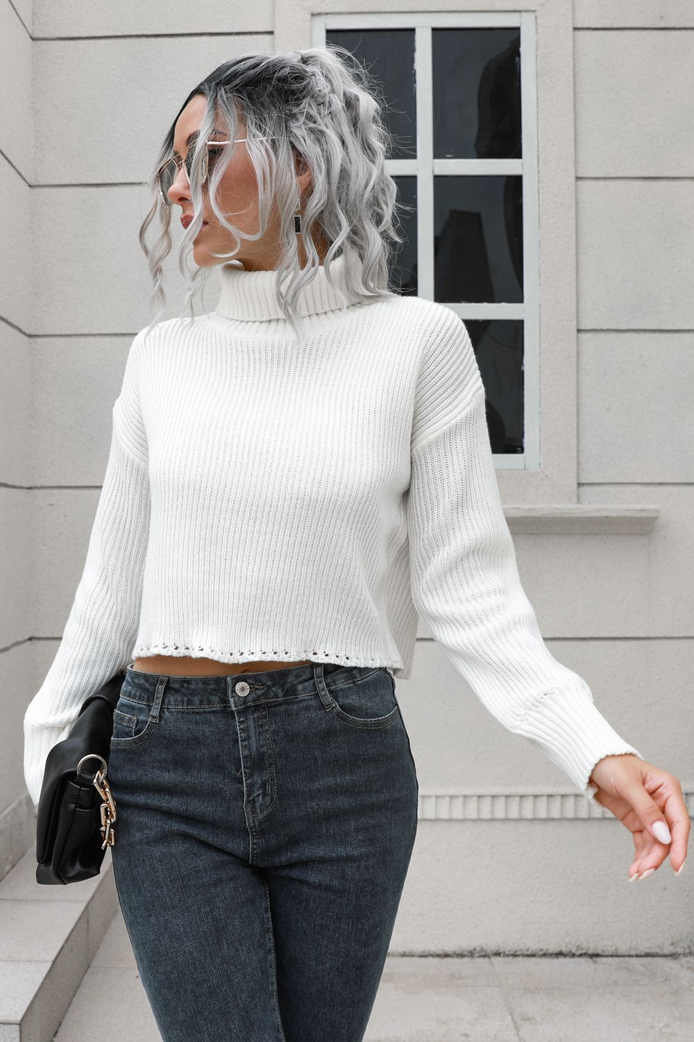 White turtleneck dropped-shoulder sweater with long sleeves and ribbed knit, cropped.