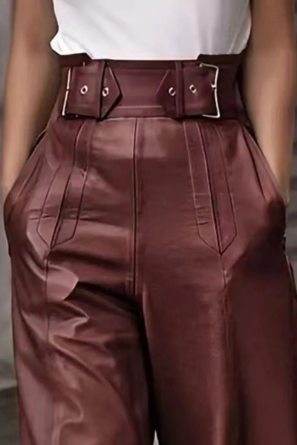 High-waist wide flare pants, burgundy, close-up waistband with metal buckle straps