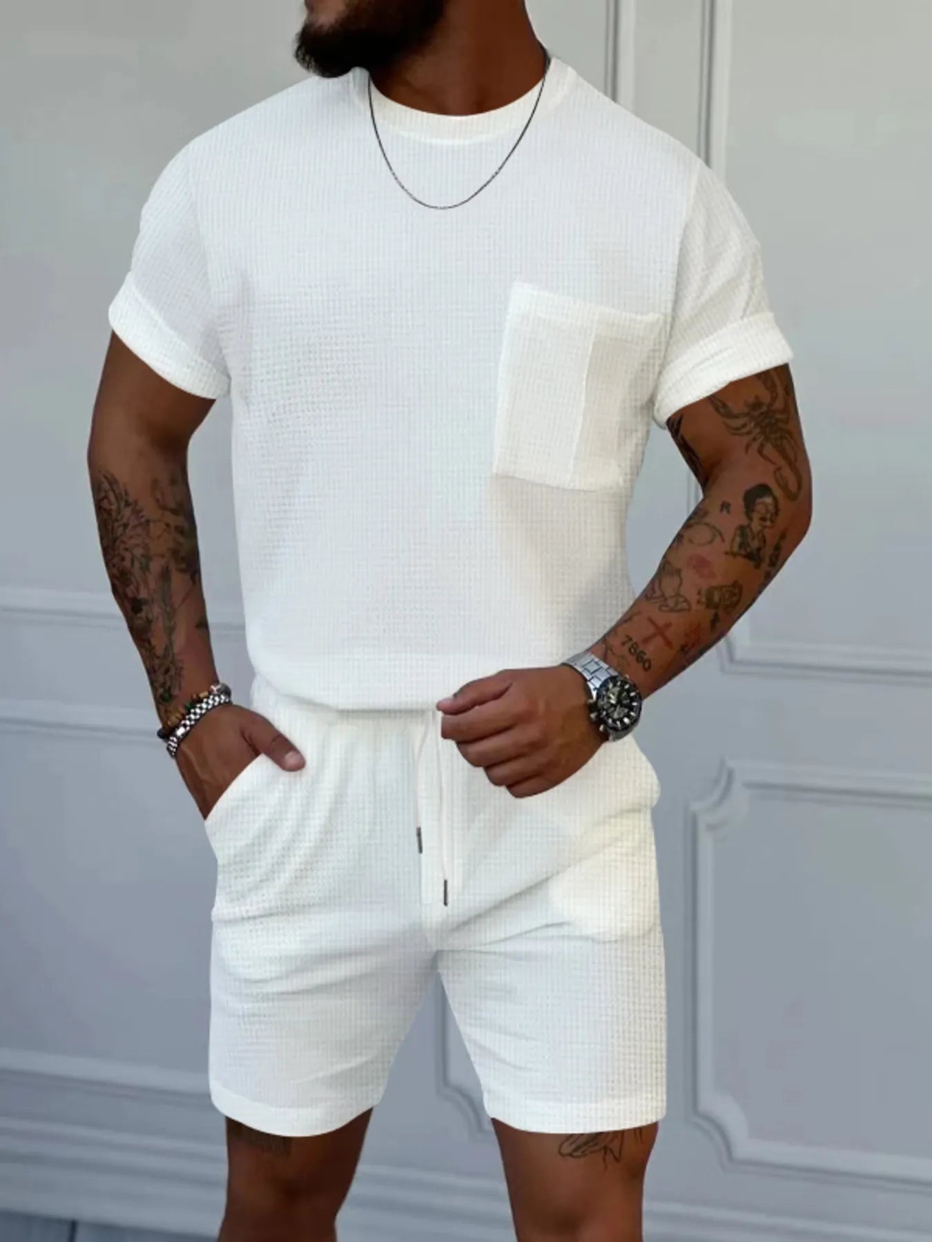 Men's white short-sleeve round-neck top and shorts set with chest pocket