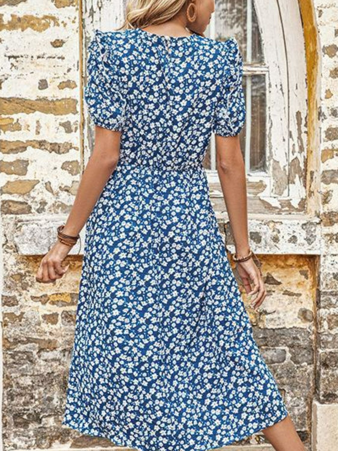 Blue floral midi dress with round neck, short puff sleeves, back view